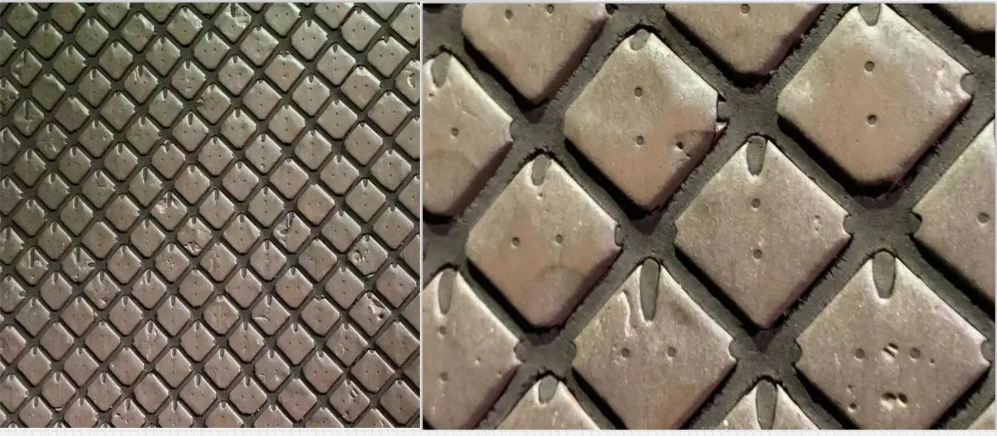 Close-up of ceramic inserts bonded into a conveyor belt carrying cover