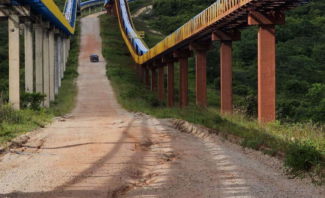 Multiple elevated conveyor routes across varied terrain